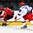 GRAND FORKS, NORTH DAKOTA - APRIL 16: Switzerland's Fabian Berni #9 skates with the puck while Russia's Veniamin Baranov #7 defends during preliminary round action at the 2016 IIHF Ice Hockey U18 World Championship. (Photo by Matt Zambonin/HHOF-IIHF Images)

